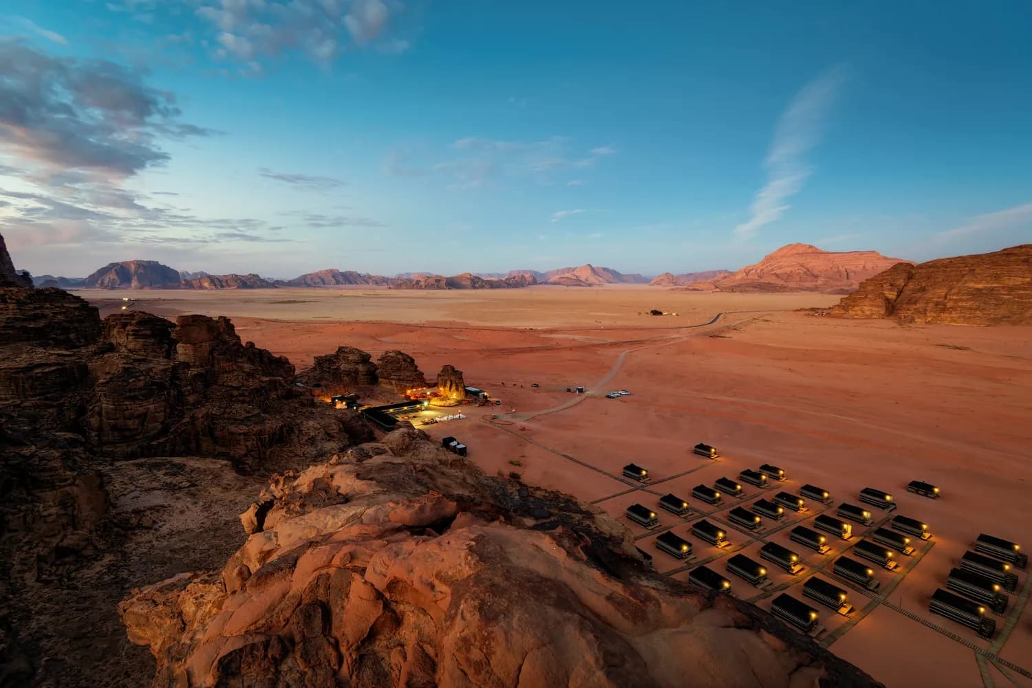Desert camp and four-wheel-drive vehicles in Wadi Rum, Jordan